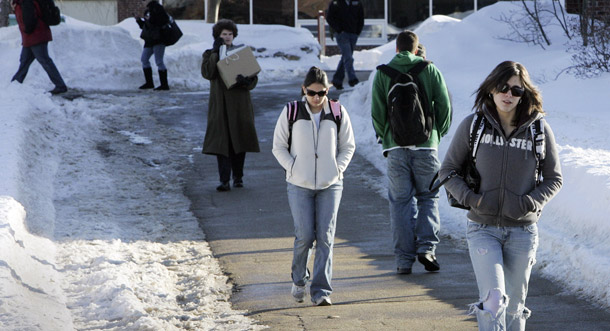 Students at New Hampshire Technical Institute walk to class in Concord, NH, January 29, 2009. Many laid-off adults are enrolling in colleges and need a college education system that matches their busy lives and delivers tangible career benefits. (AP/Jim Cole)