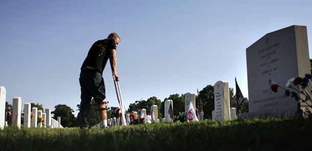 A veteran injured during his second tour in Iraq visits Arligton National Cemetary on Memorial Day last year. (AP/Lawrence Jackson)