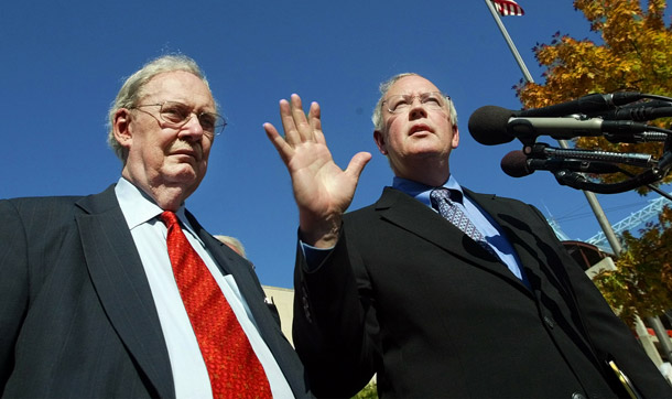 Kenneth Starr, right, and Robert Bork speak to reporters in Washington during the antitrust case against Microsoft in 2003. The Obama administration could enhance enforcement in monopolization by seeking enactment of a new statute providing the Antitrust Division and the Federal Trade Commission with enforcement authority not tied to damages liability in private actions. (AP/Pablo Martinez Monsivais)