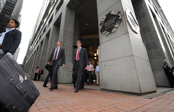 People exit the Financial Square building following the Goldman Sachs shareholders meeting on May 8, 2009 in New York. The Federal Reserve and the Treasury Department officially released the results of the bank stress tests, and several recipients of the government's $700 billion financial rescue package want to exit the program, with Goldman Sachs Group Inc. expected to lead the way. (AP / Louis Lanzano)