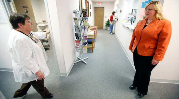 Workers at a Planned Parenthood clinic in Iowa report a sharp rise in the number of women who need help paying for care in recent months. (Ap/Charlie Neibergall)