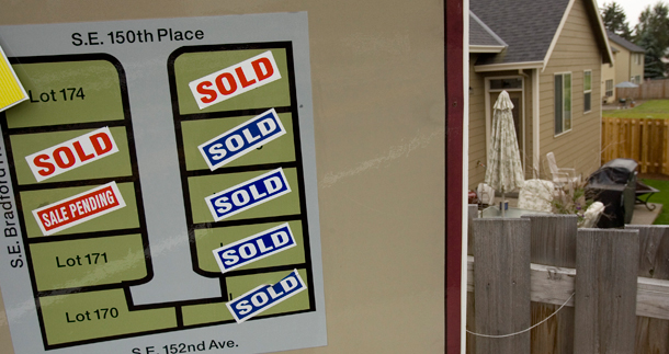 The sign for a subdivision of new homes shows houses sold and sales pending in Happy Valley, Oregon. The number of U.S. homebuyers buying a previously occupied home took the largest monthly jump in nearly eight years in April, but there are still plenty of danger signs for the U.S. housing market. (AP/Don Ryan)