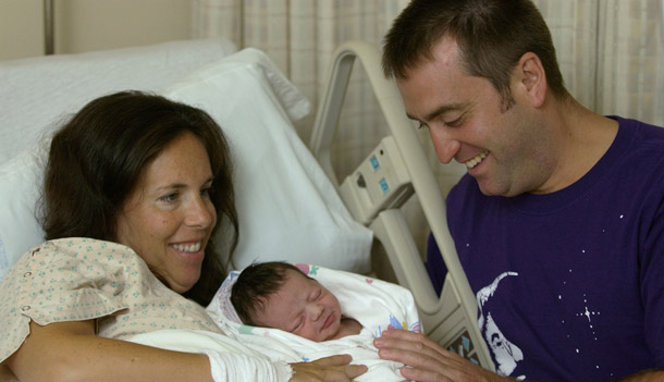 Kara and Dan O'Neil hold their newborn boy, Luke, at Greenwich Hospital in Greenwich, CT. Today the House will vote on the Federal Employee Paid Parental Leave Act, which would provide four weeks of paid leave after the birth or recent adoption of a child to most federal employees. (AP/Douglas Healey)