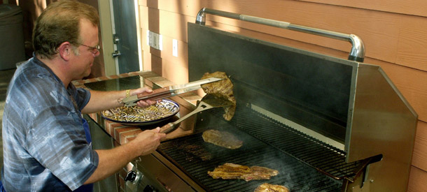 It’s summer BBQ season again, and 60 million households are expected to fire up the grill over every holiday weekend this summer, releasing about 225,000 metric tons of carbon dioxide. (AP/Joe Don Buckner)