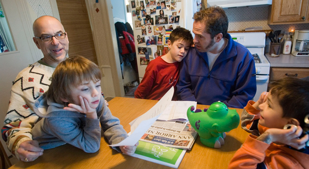 Today's announcement is a step in the right direction for families like this one that rely on domestic parner benefits to provide care and protection for their children and spouse. (AP/Tony Ding)