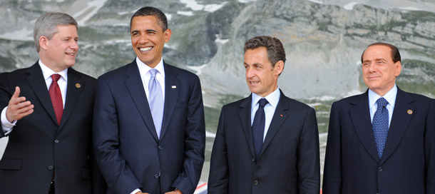 Stephen Harper of Canada, U.S. President Barack Obama, Nicolas Sarkozy of France, and Silvio Berlusconi of Italy gather for a group photo prior to the G-8 Summit in L'Aquila, Italy on July 8, 2009. (AP/Peer Grimm)