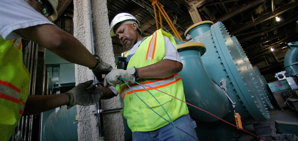 Electricians work on wiring a "green building" under construction in Las Vegas. (AP/Jae C. Hong)