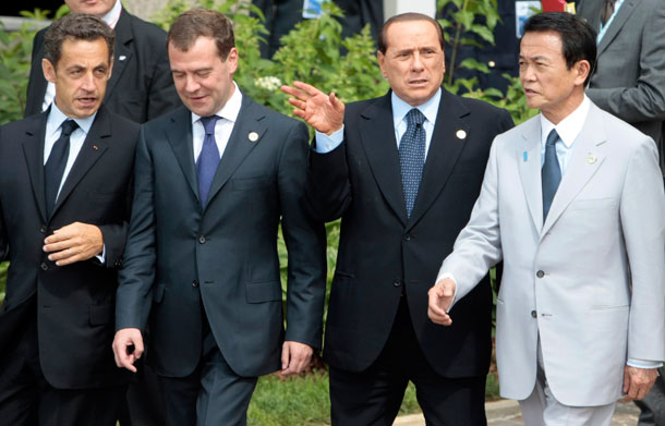 From left, French President Nicolas Sarkozy, Russian President Dmitri Medvedev, Italian Prime Minister Silvio Berlusconi and Japanese Prime Minister Taro Aso arrive for a G-8 group photo in L'Aquila, Italy, on July 8, 2009. At a time when challenges are global, the exclusivity of the G-8 is less of an asset and more of a drain on its legitimacy. (AP/Andrew Medichini)