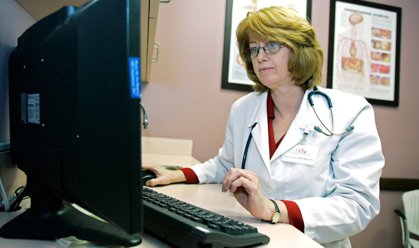 A nurse practitioner checks over a patient's electronic medical records at the Central Florida Family Health Center in Sanford, Florida. (AP/John Raoux)