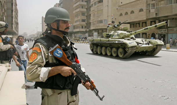 Iraqi Army patrol in central Baghdad, Iraq, on June 30, 2009. One of the key missions of U.S troops remaining in Iraq is to advise and train Iraqi security forces. (AP/Khalid Mohammed)