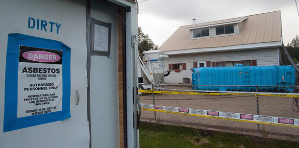 A home undergoing abatement for removal of asbestos iin Libby, Montana. The Environmental Protection Agency began investigating the town due to local investigative reporting.
<br /> (AP/Rick Sheremeta)