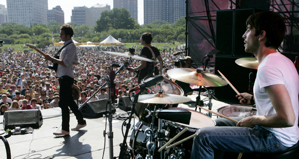 Music festivals like Lollapalooza, held each year in Chicago, are becoming more ecofriendly, and encouraging concert-goers to do the same. (AP/Charles Rex Arbogast)