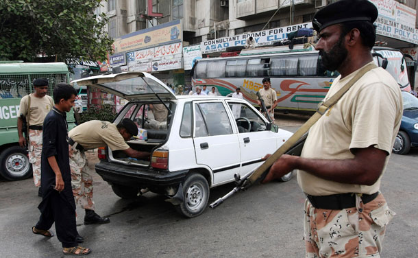 A Pakistani paramilitary soldier searches a car at a checkpoint in Karachi, Pakistan, on June 13, 2009. The defense authorization bill now before the U.S. Senate doesn’t require a strategic plan for implementing the Pakistan Counterinsurgency Fund before the funds are released—a flaw that still needs fixing. (AP/Fareed Khan)