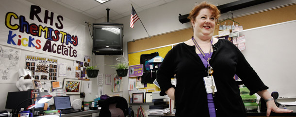 A chemistry teacher in front of her classroom in Texas. Texas has made the largest single state investment in performance-pay programs in the country with $868.1 million over a six-year period dedicated to the development of three performance pay programs. (AP/LM Otero)