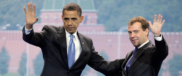 Presidents Barack Obama and Dmitry Medvedev wave as they leave Manezh Exhibition Hall during the Parallel Business Summit in Moscow. (AP/Alexander Zemlianichenko)