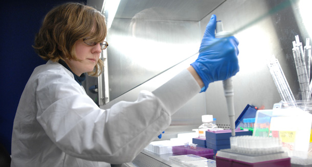 A medical researcher performs an experiment on the effects of a drug. There is a dearth of information on what the best treatments are for health conditions, which contributes to significant waste in the health system. (Ap/Josh Reynolds)