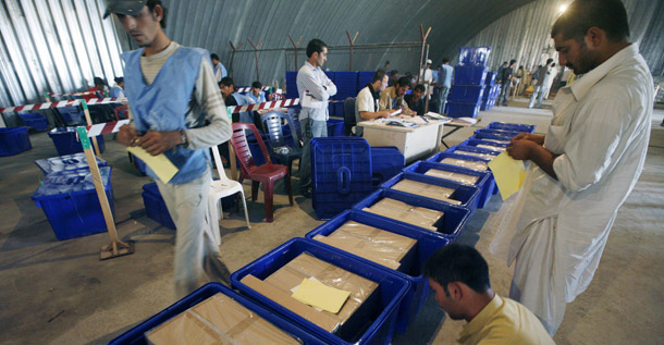 Afghan employees of the Independent Election Commission place labels on ballot boxes to show which province they belong to at the main election commission office in Kabul, Afghanistan on August 4, 2009. (AP/Musadeq Sadeq)