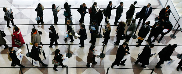 Applicants wait in line at a job fair in New York City; it will likely take years to bring the unemployment rate down to pre-crisis levels. (AP/Mark Lennihan)