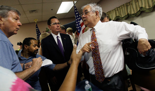 Rep. Barney Frank (D-MA), right, speaks to people as he leaves a senior center in Dartmouth, MA, on August 18, 2009, where he discussed health care reform and financial issues at a town hall-style meeting. (AP/Elise Amendola)