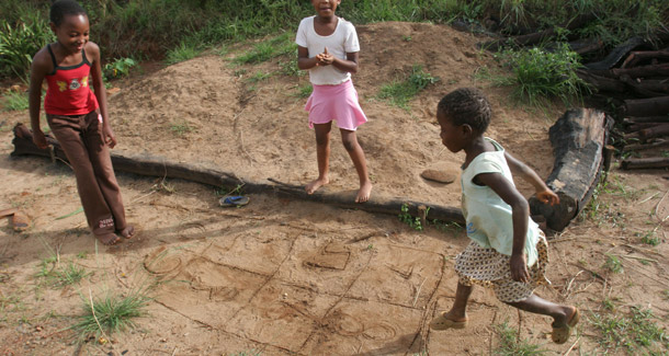 Children play hopscotch at Motjane, just outside the Main Swaziland capital, Mbabane. Sustainable security is a bold rethinking of national security that introduces the notions of collective and human security and rebalances the three tools of foreign policy—defense, diplomacy, and development. (AP/Denis Farrell)