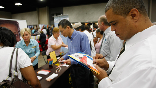 A man fills out an application for a United Parcel Service during a job fair sponsored by the National Urban League in Louisville, Kentucky. (AP/Ed Reinke)