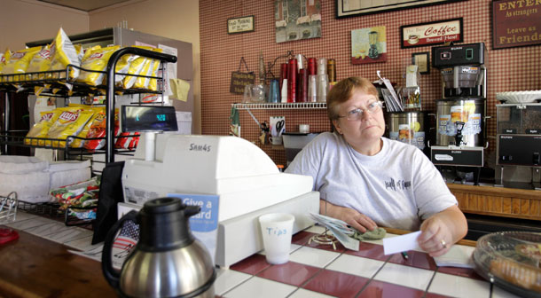 Patty Porter works the front counter of the tiny Hall of Fame Cafe, in downtown Wheeling, West Virginia. She and her husband, a receiving manager at Kmart, count themselves among the Americans who lack adequate health insurance coverage. David Balto believes the mission of the Federal Trade Commission and the DOJ's Antitrust Division is vital to protecting consumers and health insurance competition. (AP/Amy Sancetta)