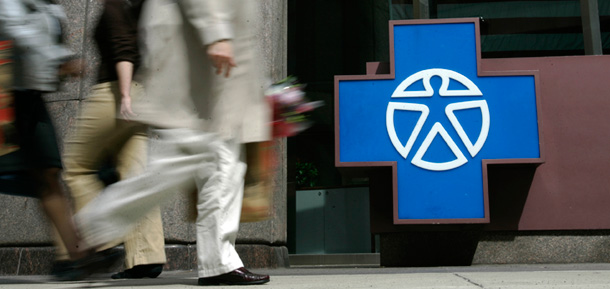 Pedestrians walk past the entrance of Independence Blue Cross headquarters in Philadelphia, Pennsylvania. (AP/Matt Rourke)