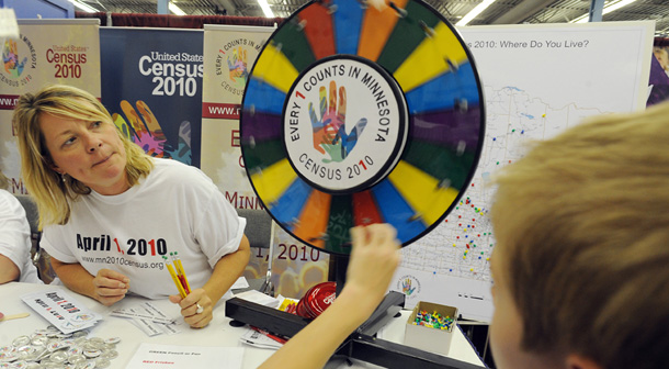 A Census volunteer runs a game at the Minnesota State Fair to promote the 2010 Census. (AP/Craig Lassig)