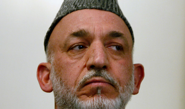 Intense international pressure was critical to Afghan President Hamid Karzai’s decision to let the constitutional process to run its course and allow for a second round of voting. (AP/Musadeq Sadeq)