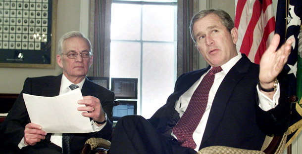 President George W. Bush meets with Treasury Secretary Paul O'Neill in O'Neill's office on March 7, 2001, to discuss Bush's tax cuts. When the cuts sunset at the end of 2010, the previous administration will have left the government holding the bag for well over $2 trillion in lost revenue. (AP/Ron Edmonds)