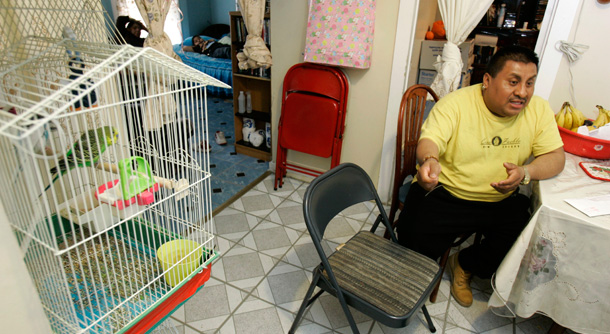 A day laborer from Puebla, Mexico who now lives in Passaic, New Jersey, talks about his experiences with worsening wage abuse as the economy has declined. (AP/Mike Derer)