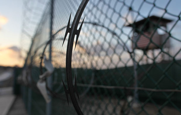 Razor wire fences surround a guard stand at Guantanmo Bay, Cuba. (AP/Brennan Linsley)