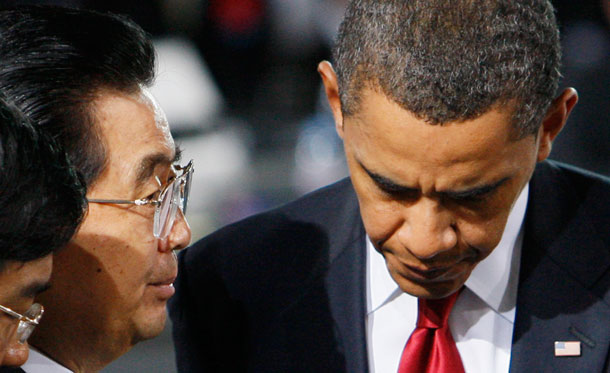 President Barack Obama talks with China's President Hu Jintao at the start of the morning plenary session at the G-20 summit in Pittsburgh. The two leaders made progress at a summit this month on a range of shared issues. (AP/Charles Dharapak)