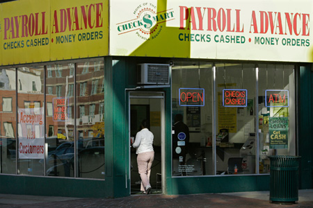 "Praying robber" Greg Smith, walked into a payday loan center like this one, but left with only $20 after talking to worker Angela Montez about his troubles. (AP/Al Behrman)