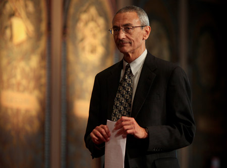 John Podesta walks from the podium after introducing His All Holiness. (CAP)