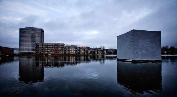 A cube created by Italian artist Alfio Bonanno, displayed on Sankt Jorgenlake during the UN Climate Summit in Copenhagen,  represents one metric ton of carbon dioxide. (AP/Jens Panduro)