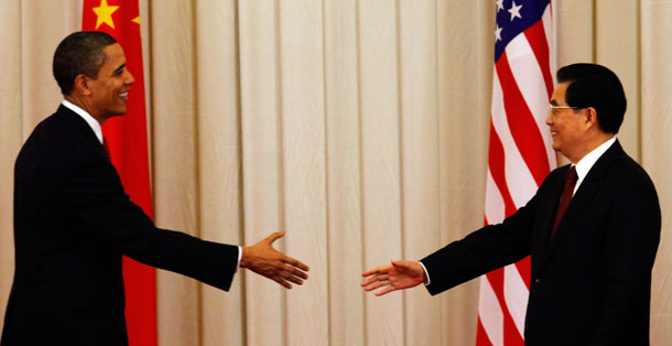 President Barack Obama and Chinese President Hu Jintao reach out to shake hands after a press conference at the Great Hall of the People in Beijing, China.<font color=