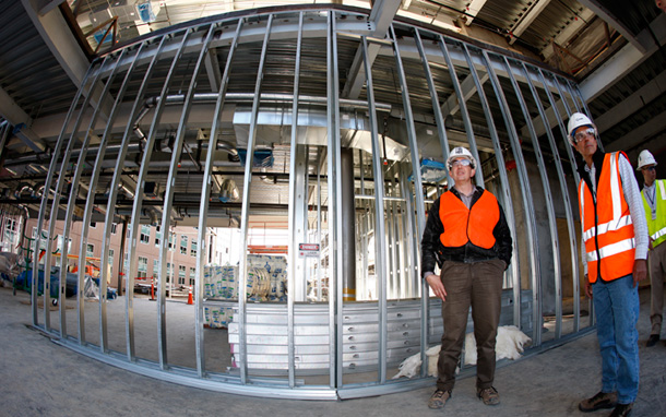 An architect and construction manager discuss materials at the site of the Research Support Facilities Project for the National Renewable Energy Laboratory, which they hope will provide a national blueprint for making buildings greener and cutting energy use. (AP/David Zalubowski)