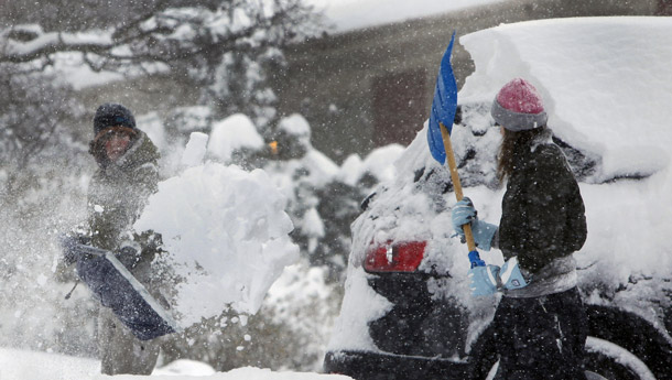 Residents dig their cars out of the snow in Annandale, VA, on December 19, 2009. The runoff from deicers used to clear ice and snow from roadways and sidewalks can damage water supplies and ecosystems. (AP/Ron Edmonds)
