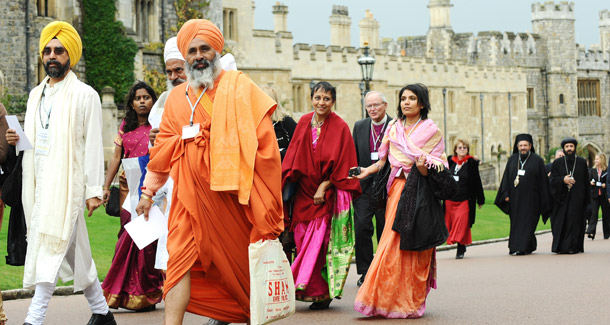 Delegates arrive at the Many Heavens, One Earth Celebration held in Windsor, England last month. Each of the 30 religious and interfaith groups at the event made commitments to sustainability and conservation. (AP/Carl de Souza)