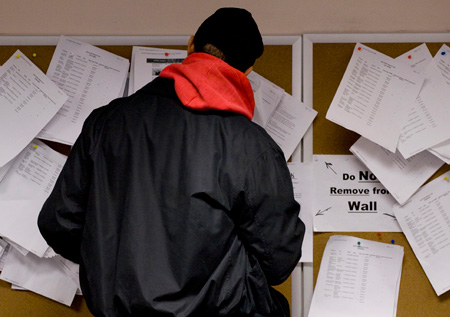 A man searches through job listings in the New York State Labor Department's Division of Employment Services in Brooklyn, NY on Wednesday, January 6, 2010. (AP/Mark Lennihan)