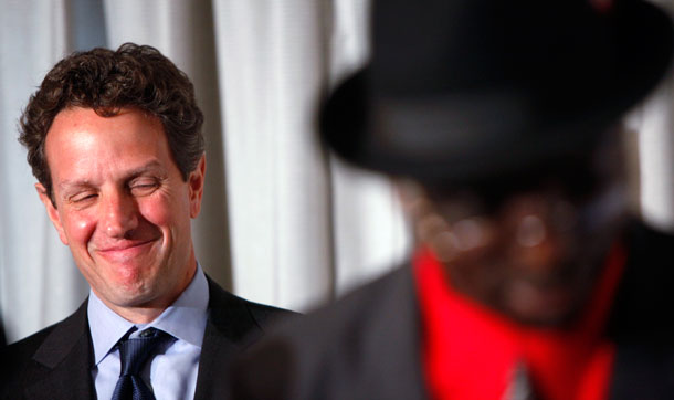 Treasury Secretary Timothy Geithner, left, grins after listening to Nicholas Tekperety of Reston, VA, foreground, share his experiences with participating in the Home Affordable Modification Program on May 14, 2009, in Washington. New mortgage relief guidelines are important steps forward but fall short of the needs of many responsible but beleaguered homeowners. (AP/Haraz N. Ghanbari)