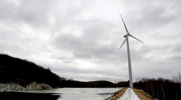 A 1.5 megawatt wind turbine built by Jiminy Peak Mountain Resort rises high above the tree line near the summit of Jiminy Peak in Hancock, MA, on December 16, 2008. (AP/Stephan Savoia)