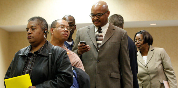 Job seekers wait in line to speak to potential employers at a job fair in Philadelphia; all Ameircans have been hurt by the recession, but minorities have been disproportionately affected. (AP/Matt Rourke)