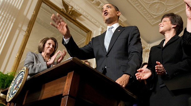 President Barack Obama waves after signing an Executive Order creating the White House Council on Women and Girls in March 2009. (AP/Ron Edmonds)