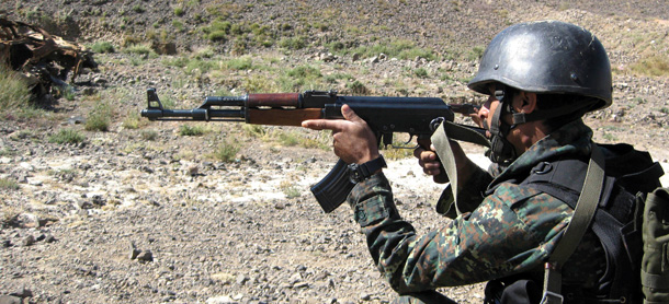 A Yemeni anti-terrorism soldier performs a shooting exercise in the Sarif region, on the outskirts of the Yemeni Capital San'a. (AP)