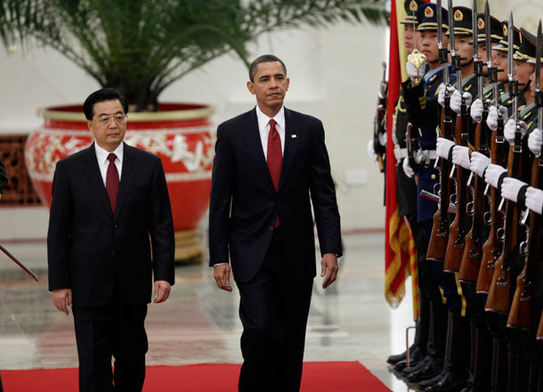 President Barack Obama is accompanied by China's President Hu Jintao as they review an honor guard at the Great Hall of the People in Beijing. (AP/Charles Dharapak)