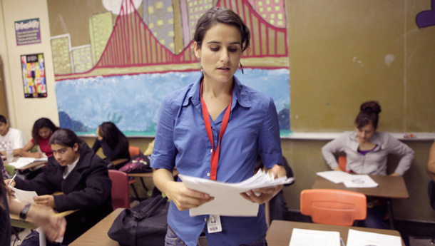 An English teacher hands out final exams at Richmond High School in Richmond, California. (AP/Marcio Jose Sanchez)