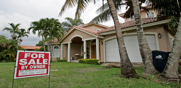 A house for sale is shown in Miami Springs, Florida, on July 23, 2009. FHFA’s quarterly house price index showed a 1.2 percent decline in the price of homes purchased during the fourth quarter of 2009 compared to a year earlier. But compared to the third quarter, prices were only off 0.1 percent on a seasonally adjusted basis. (AP/Alan Diaz)
