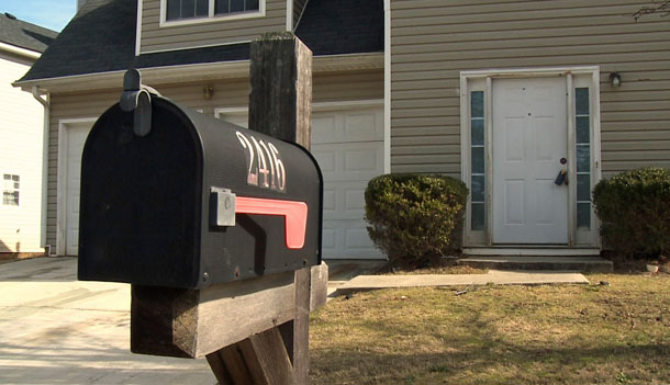 The exterior of a foreclosed home is shown in Lithonia, Georgia, on March 4, 2009. A proposed program would convert already foreclosed homes owned directly by the federal government into thoroughly energy efficient, affordable rental homes that can be resold as portfolios of rental properties to private investors. (AP/Jason Bronis)